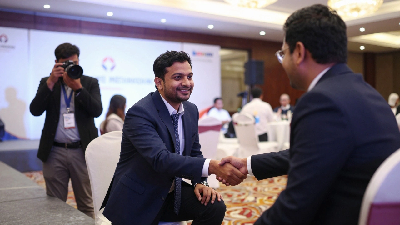 Professional handshake at corporate event in Delhi ballroom under spotlight.